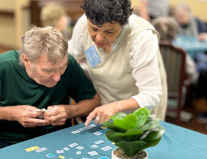 Elder using Poem Renovation with the help of an aide